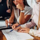 Colleagues analysing data, insights, and strategy
